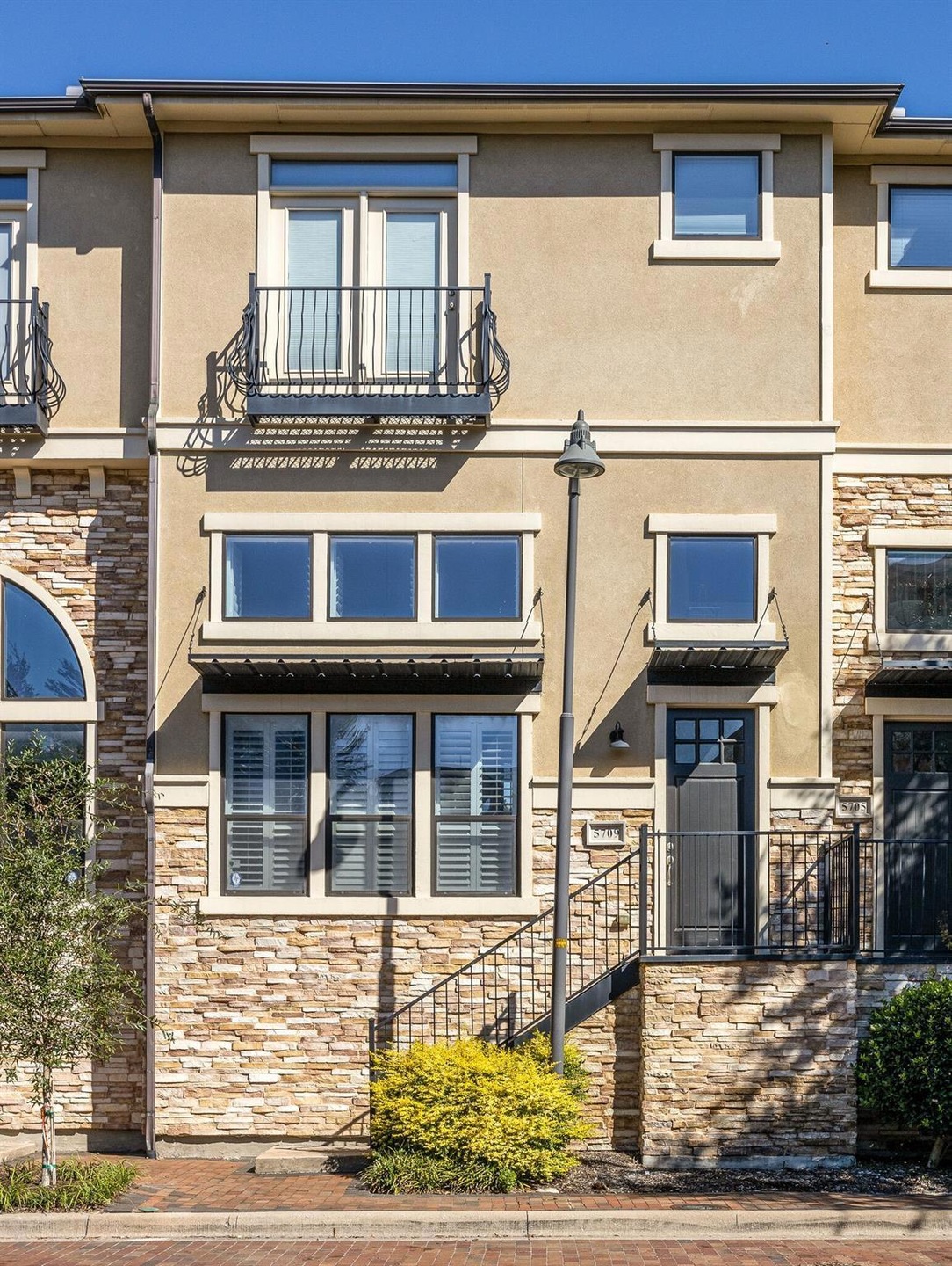 Townhome / multi-family property featuring a balco