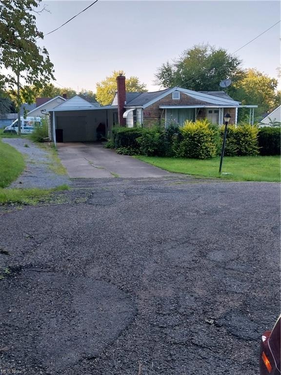 View of front of property with a front yard