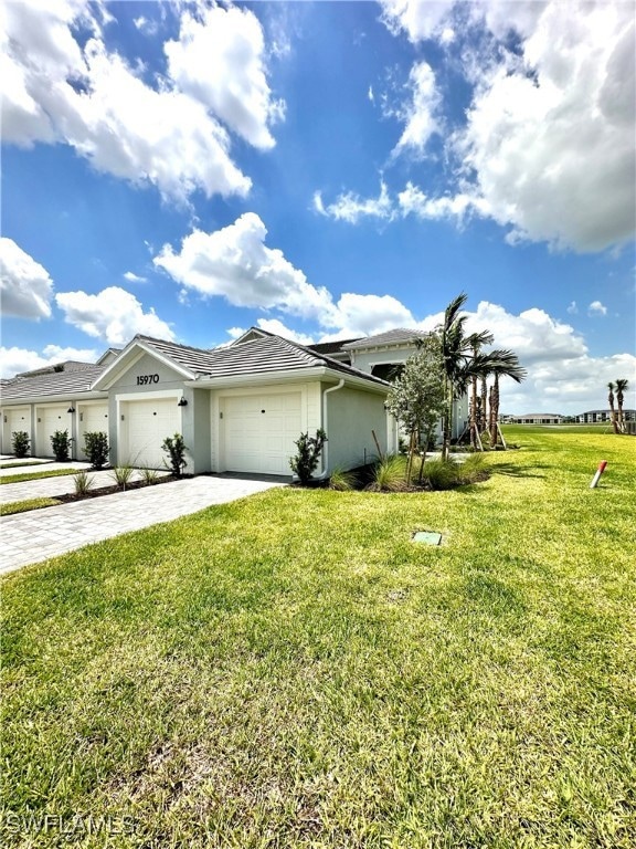 View of front of property featuring a garage and a