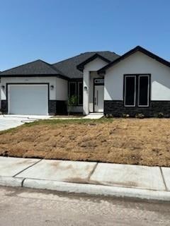 View of front of home featuring a garage
