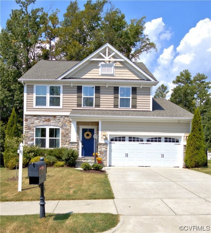 Craftsman house with a front lawn