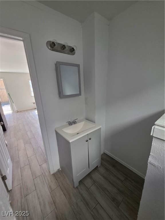 Bathroom with vanity and wood finish floors