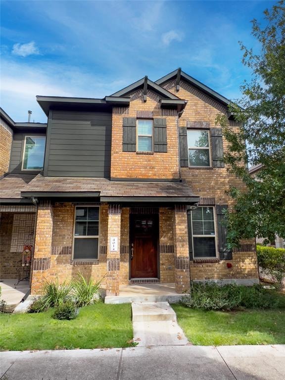 Craftsman-style home with brick siding and roof w