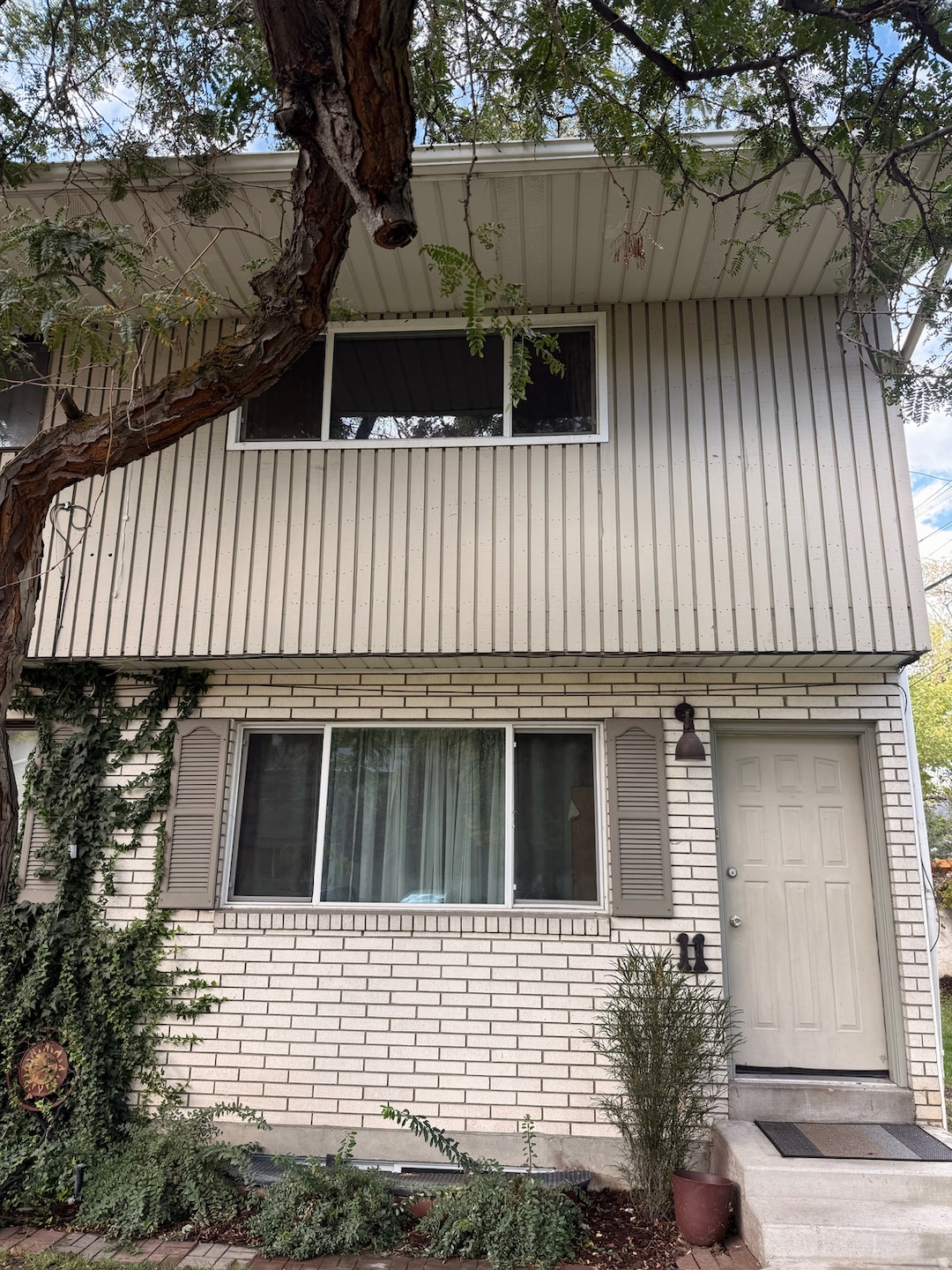 View of side of home with brick siding