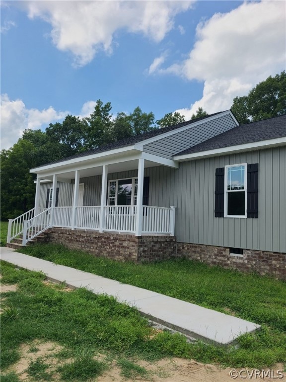 View of front of property featuring covered porch.