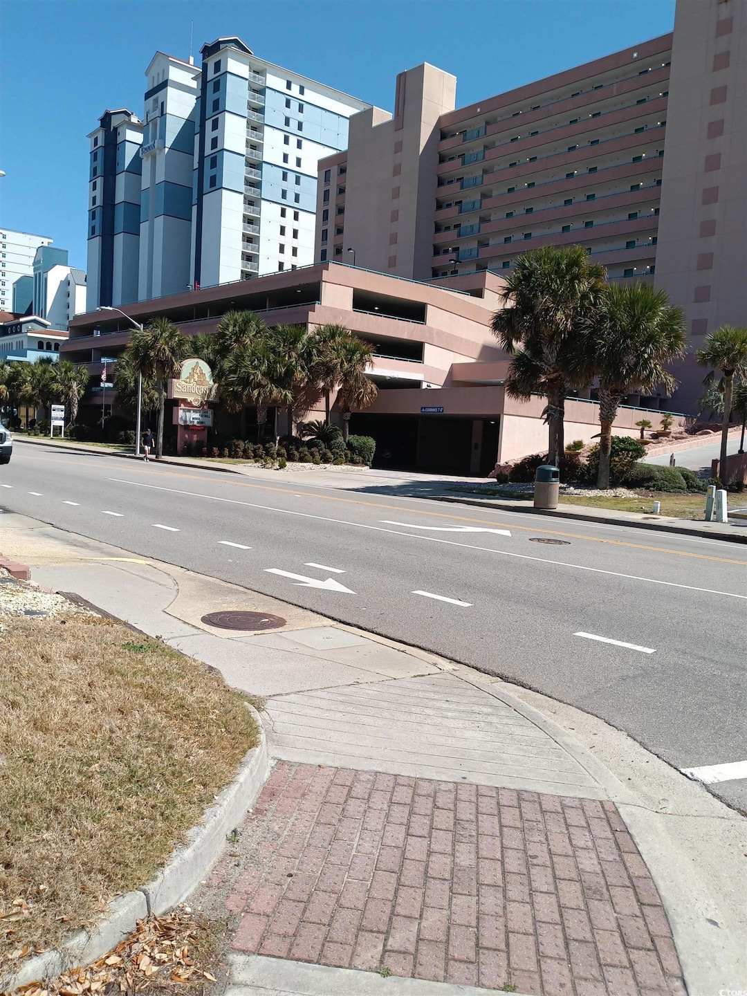 View of street with street lights, curbs, and side