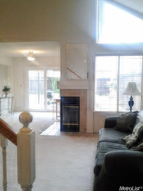 Bright open floor plan with high vaulted ceilings.