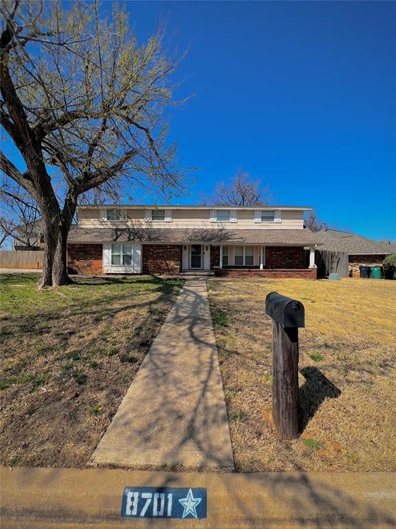 Ranch-style home with a front yard