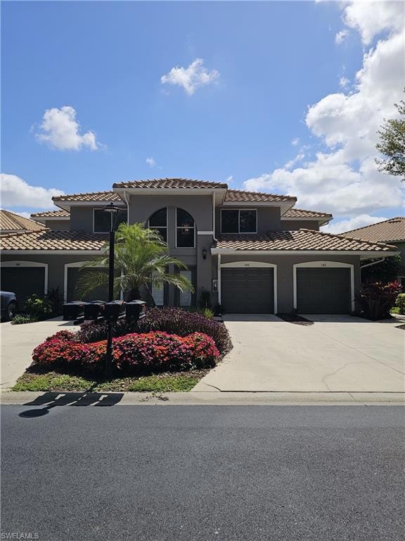 Mediterranean / spanish-style home featuring concr