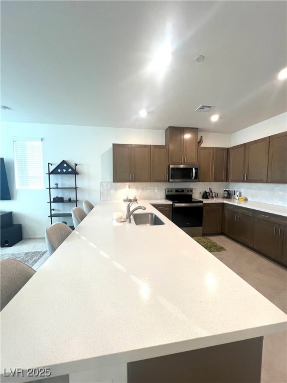Kitchen with appliances with stainless steel finis