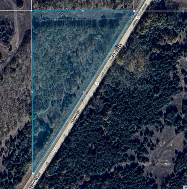 Aerial overview of property's location featuring property boundaries highlighted
