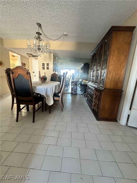 Dining area with a textured ceiling and a chandeli