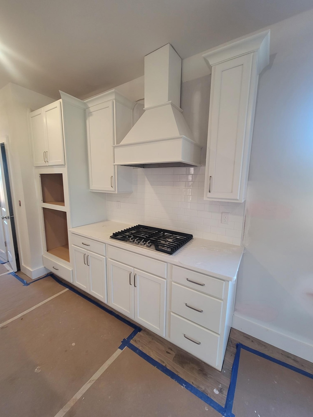 Gourmet kitchen with wood hood