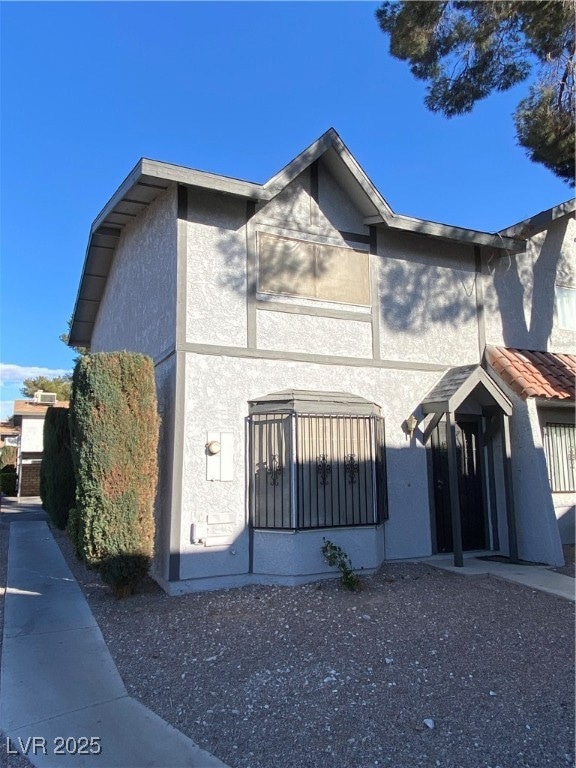 View of front of home featuring stucco siding