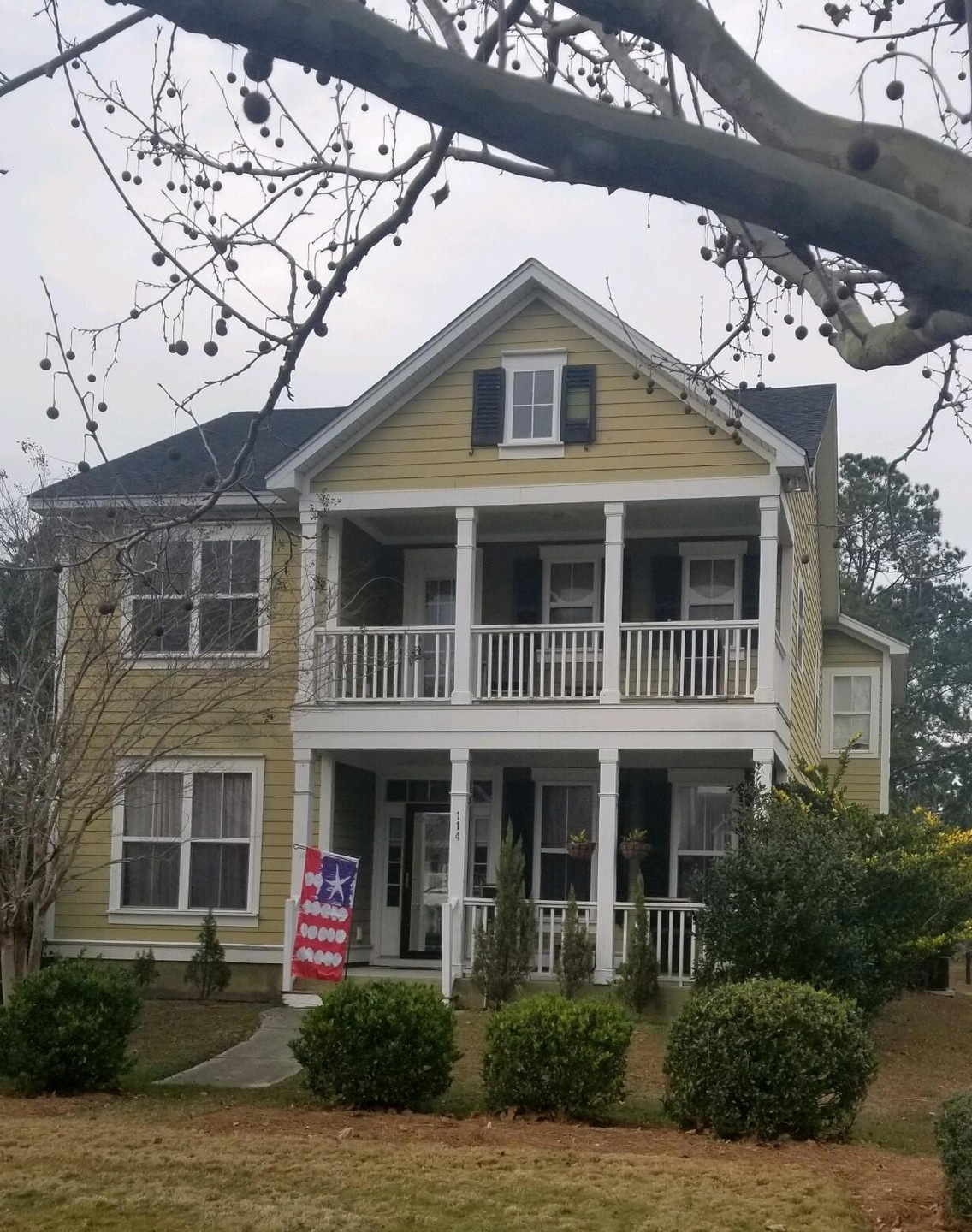 114 red Leaf front of house
