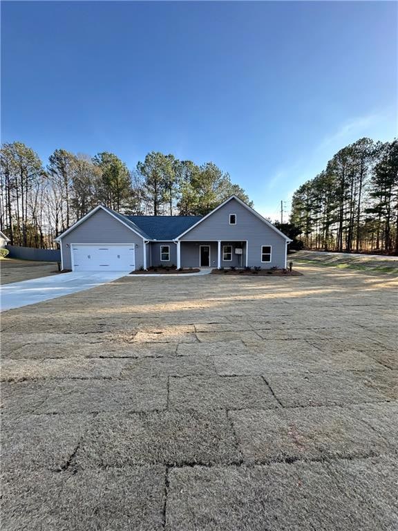 View of front facade with a front yard, an attache