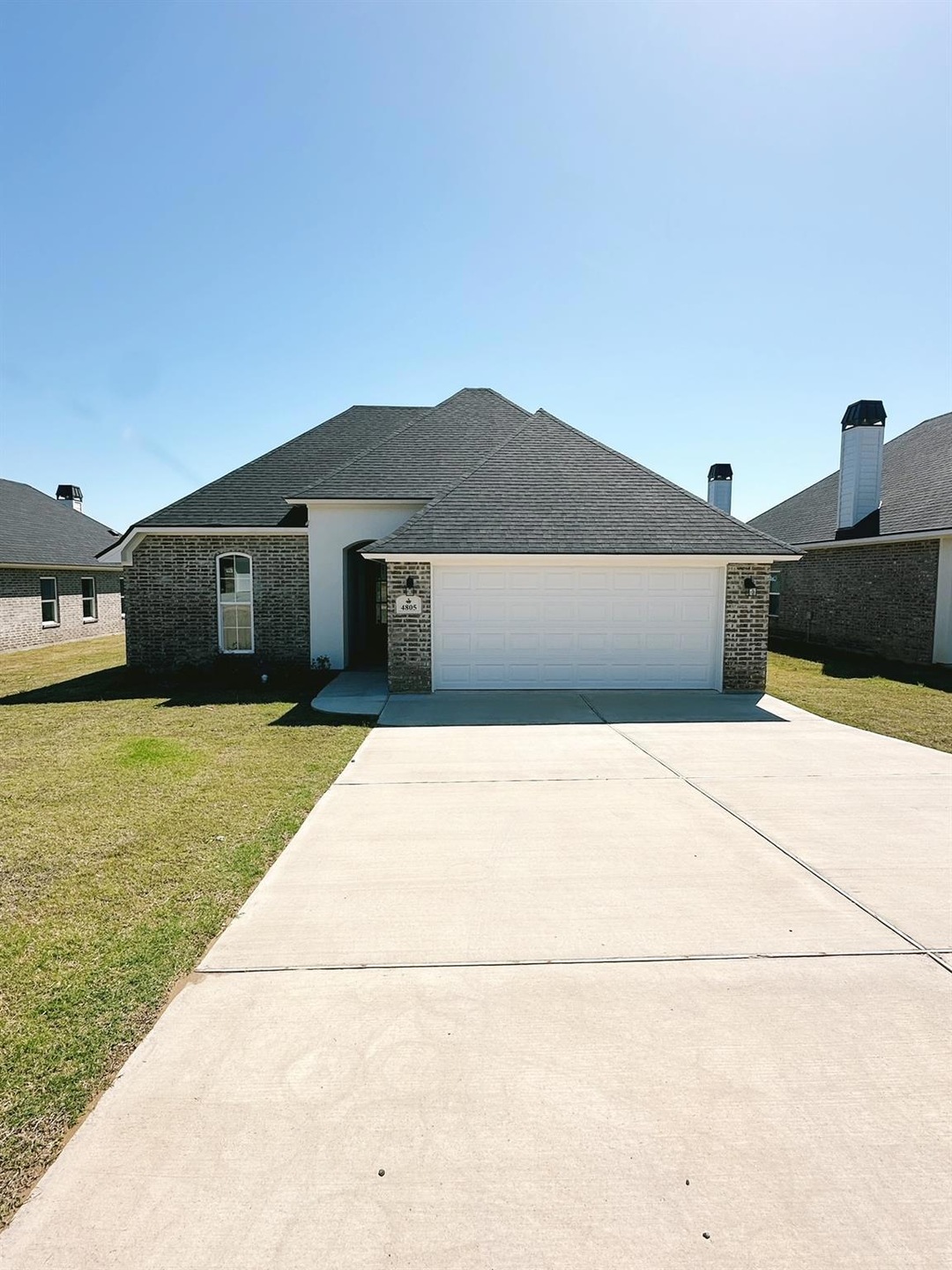 View of front of home featuring a garage and a fro