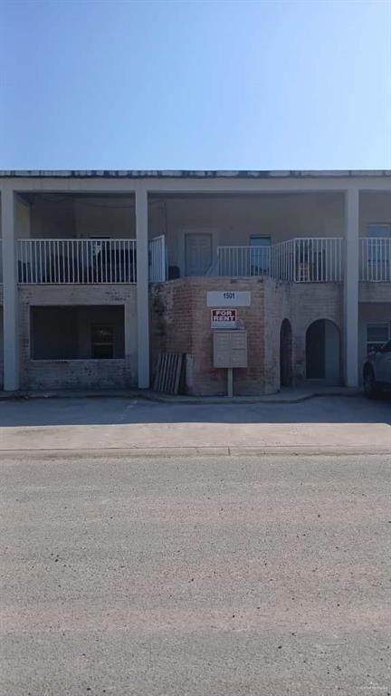 View of front of property with brick siding
