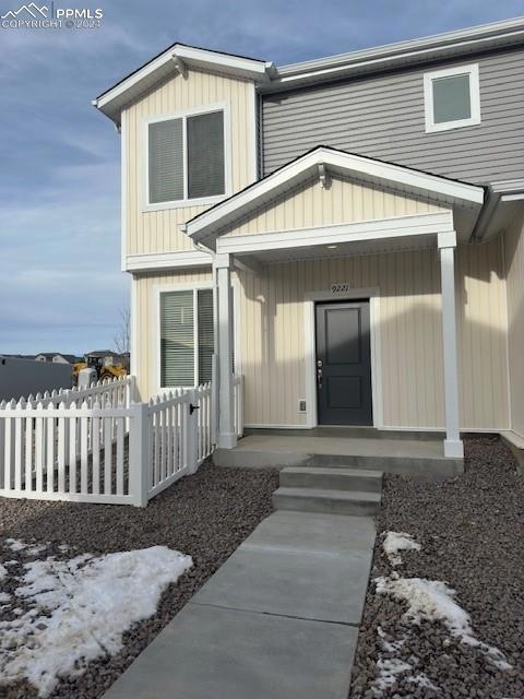 Entrance to property with covered porch