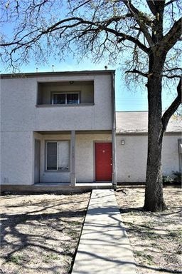 View of front facade featuring stucco siding