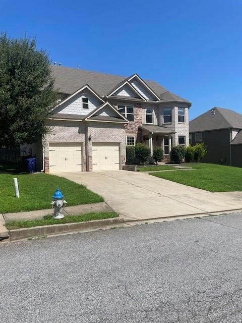 View of front of house with a front lawn and a gar
