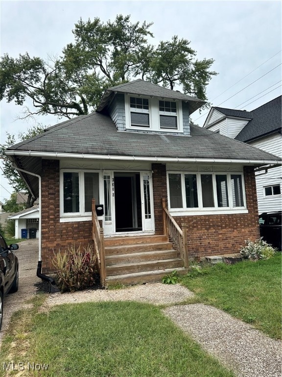 View of front of property with a front lawn