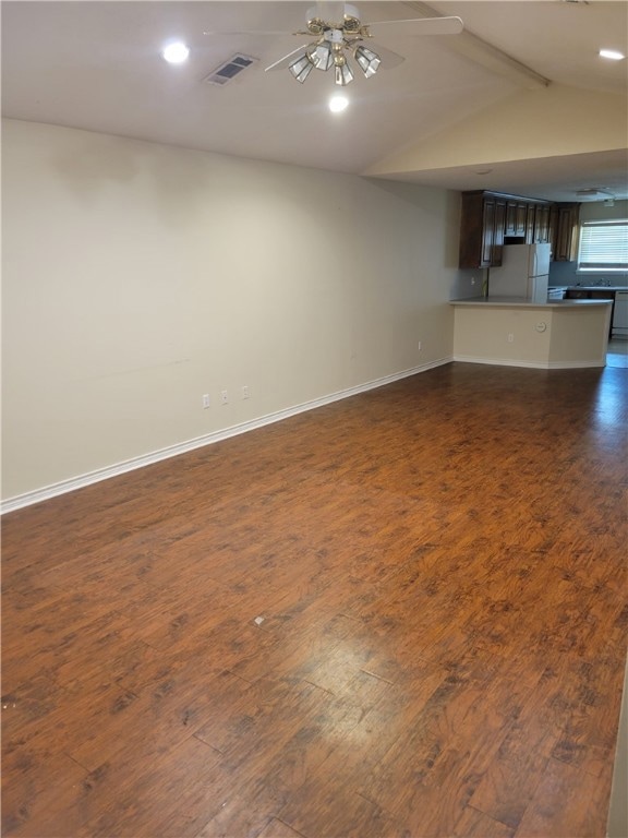 Unfurnished living room with dark wood finished fl