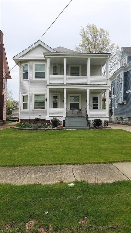 Nicely landscaped and two front porches!