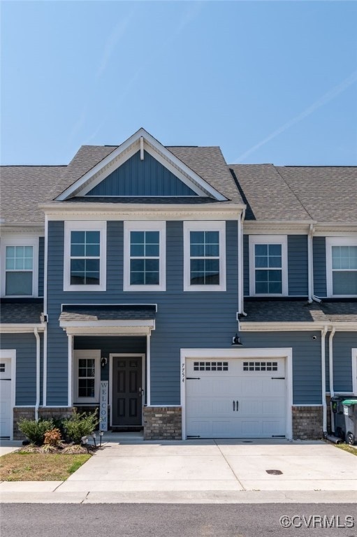 View of front facade featuring an attached garage,
