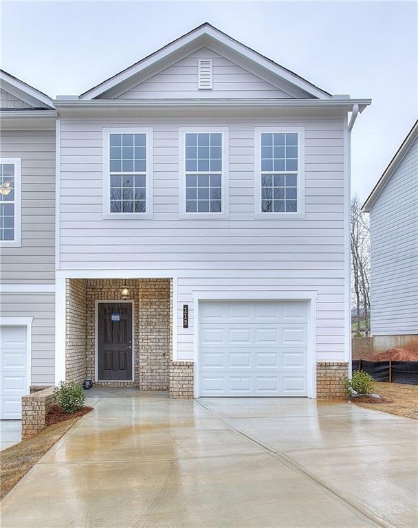 View of front of home featuring a garage