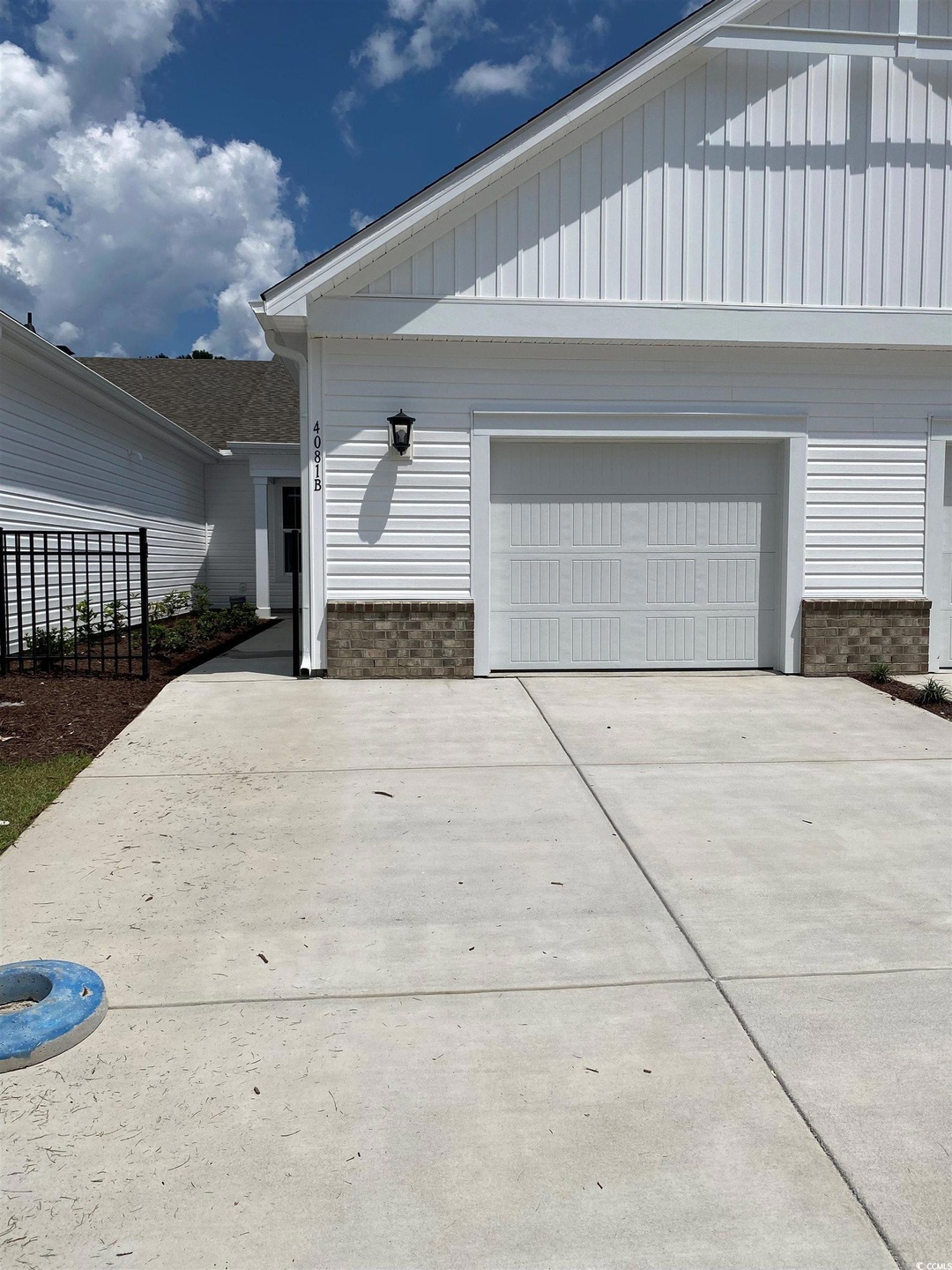 View of property exterior with a garage