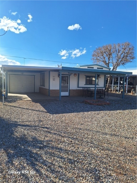 View of front of property with driveway, an attach
