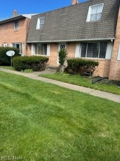 View of front of house with a front lawn