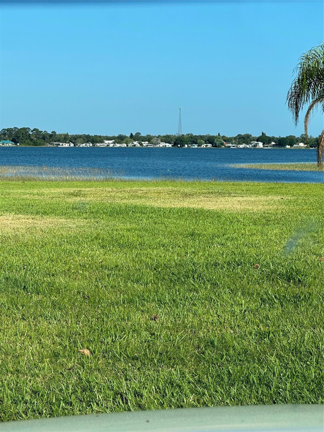 The lot sits 3 houses from beautiful LAKE GRASSY I