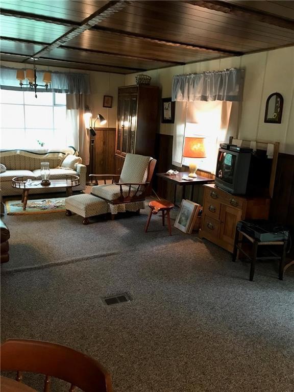 Large living area with big windows.