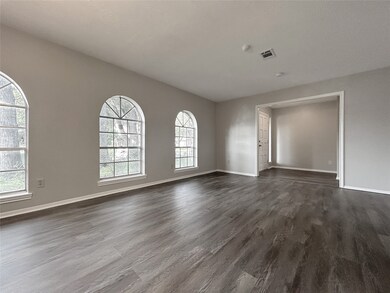 Den/Dining areas with wall windows.