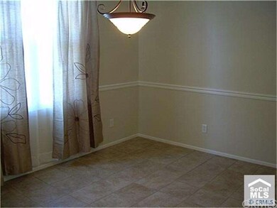 Formal dining area with new curtains & tile floori