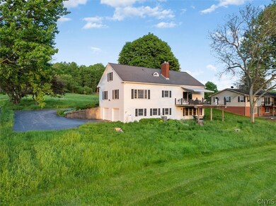 Large rear deck and stone patio overlooking golf c