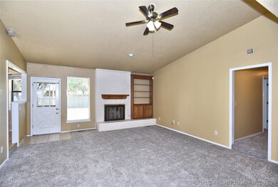 Back Door in Living area to back patio and Pool.
