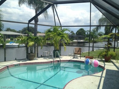 Screened pool overlooking canal