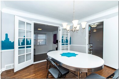 Dining room features a set of French Doors wit glass inserts opening onto the Sunroom