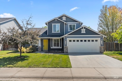 Craftsman inspired home featuring stone siding, concrete driveway, and an attached garage