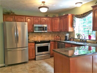 Amazing kitchen with cherry cabinets and granite c