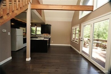 Looking from fireplace back into kitchen
