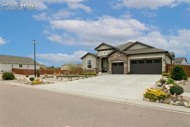 Stucco and stone exterior with tandem four car garage and extended driveway.