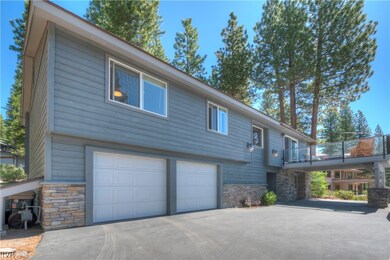Driveway leads to a two car garage, extra covered parking space near front door and extra space for additional vehicle or boat.