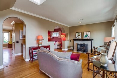 The formal living room has a fireplace and opens t