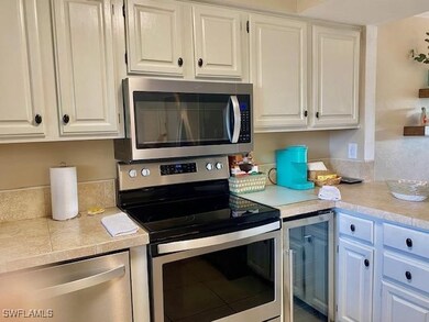 Kitchen featuring appliances with stainless steel