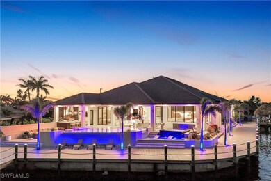 Back of property at dusk featuring a jacuzzi, an i