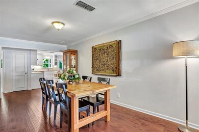 Engineered wood floors flow throughout the main li